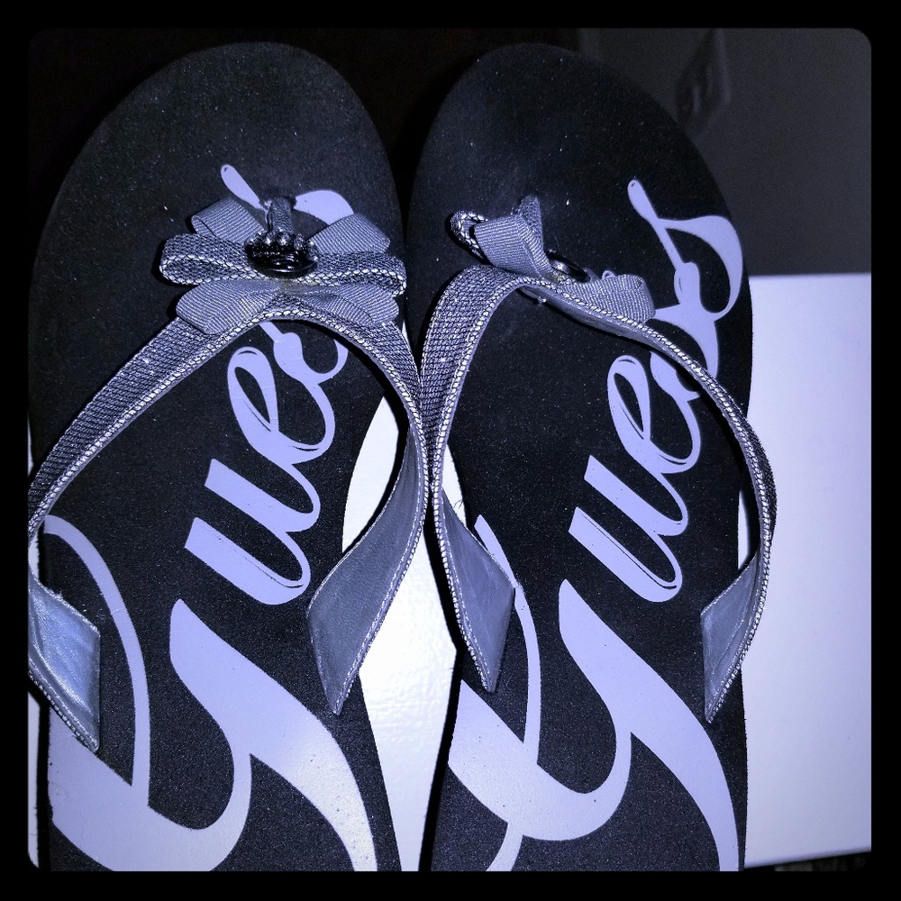 Black with Silver straps Guess flip flops